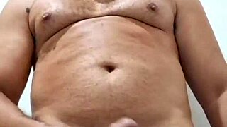 Yuri Gaúcho, Brazilian bear, delivers amateur handjob with massive cumload in solo.