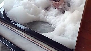 Spying on the brunette bathing! She comes in and fucks her pear-shaped ass with a monster cock!