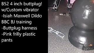 Sissy gets ready for extreme self-bondage with a massive black dildo.