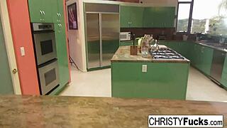 Hot Christy Mack teases on the kitchen counter, rubbing her amazing tits and wet pussy