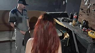 Young woman takes car to mechanic in garage