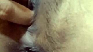 Pretty Indonesian girl fingers her tight swollen pussy