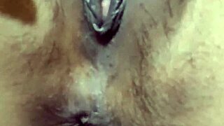 Pretty Indonesian girl fingers her tight swollen pussy