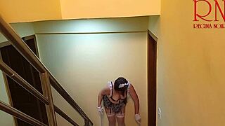 Depraved maid Regina Noir shows pussy while cleaning stairs in big house