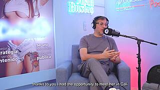 Cristina Vega on webcam as a Latina model uses a machine on Juan Bustos podcast