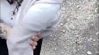 Hot woman receives spanks outdoors