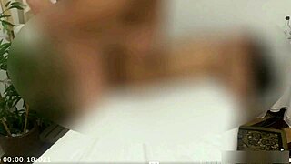 Camera films young woman during tantric massage session