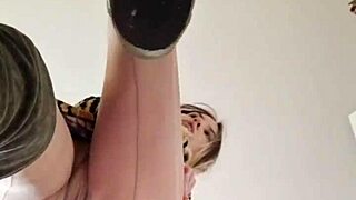 Elza Koms performs striptease and footjob with ass worshiping