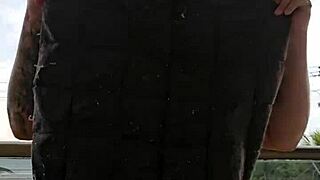 Girl flashing ass on balcony in skirt