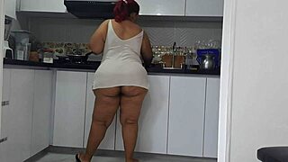 Intensely masturbating while watching stepmother's big ass in the kitchen.