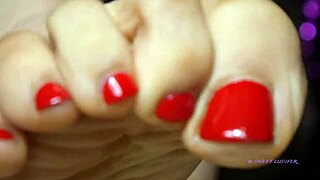 petite mistress with red toenail polish dominates sensually
