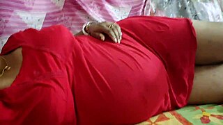 The wild hot desi girlfriend in red receives a hot body massage from her old friend, showcasing her big ass and sexy curves