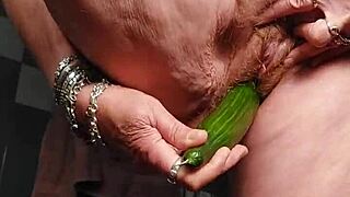 German Granny Slams Hairy Pussy with Cucumber in Wild Action