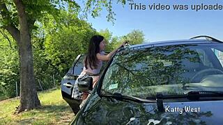 crazy teen girl squirts wildly on the car roof to clean the windshield!