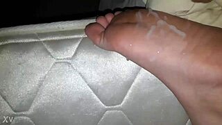 guy shoots cum on her feet in casual scene