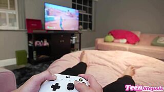 Horny teen stepsis teases step-bro with hairy pussy while he games, distracting with raw action.