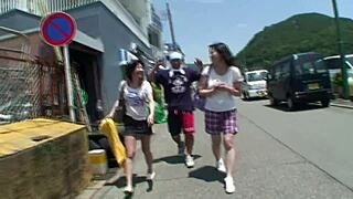 Two Japanese female backpackers meet older guys for fun in a hostel dorm.
