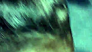 A woman performs oral sex on a large penis