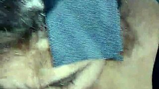 A woman performs oral sex on a large penis