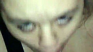 A woman performs oral sex on a large penis