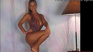 busty teen in slingshot dress dancing on stage