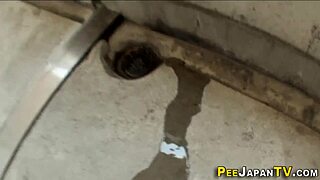 Hey, wanna see this Asian babe pee in public under watchful eyes?