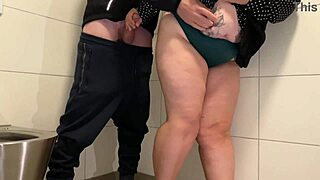 juicy milf gives a handjob in the public toilet