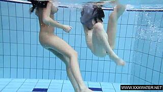 Explore this shaved brunette with big tits underwater in the pool! 🌊🍑