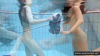 Explore this shaved brunette with big tits underwater in the pool! 🌊🍑