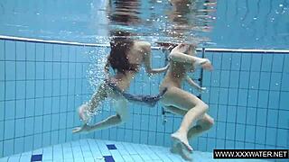 Explore this shaved brunette with big tits underwater in the pool! 🌊🍑