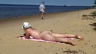 Funny beach day turned wild meeting a juicy milf. Flashing her curvy ass outdoors!