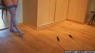 A redhead babe enjoys skipping rope topless, her big tits bouncing in stockings.