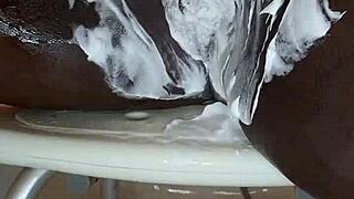 black milf shaves her wet pussy while masturbating with toys