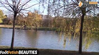 i love the brunette babe taking off socks barefoot in park