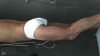 Shaved woman bathes in shower