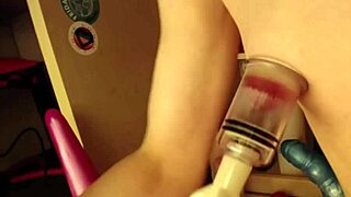 blonde babe plays with giant beehive dildo and nipple suckers