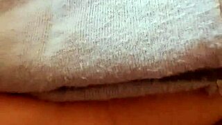 this milf is touching herself in pajamas in the bedroom