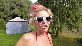 flashing shaved pussy in pink monokini 😏 garden fun