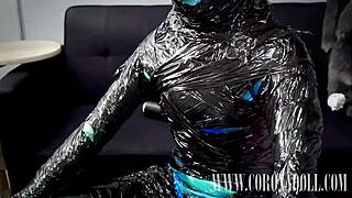 femdom mummification with gloves shoes heels catsuit leather masked