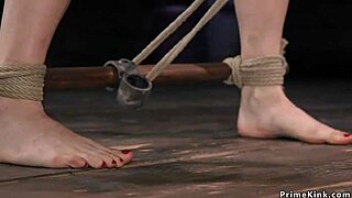 The huge tits babe endures bizarre bondage and choking while getting double penetration with dicks on a stick.