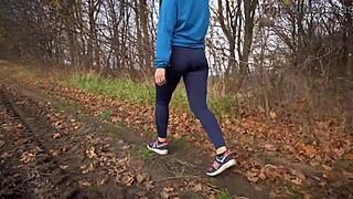 Milf's tight ass in spandex yoga pants from behind.