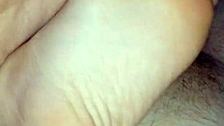 Homemade bare footjob with big cumshot
