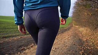 Milf's tight ass in spandex yoga pants from behind.