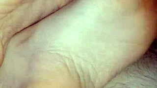 Homemade bare footjob with big cumshot