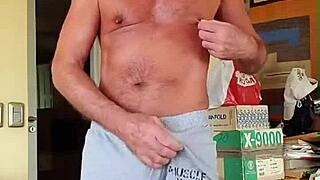 pervy guy rubs his bulge in tight shorts.