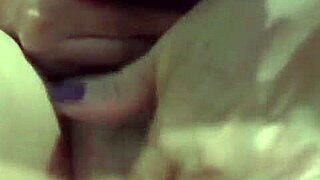 Mature woman indulging in a private intimate moment with herself, enjoying some alone time