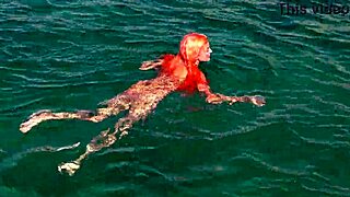 a skinny girl flashes her wet shaved pussy in blue water