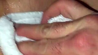 Blonde milf spreads her wet shaved pussy wide open.