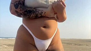Redhead Flashes Big Swollen Pussy On Beach!