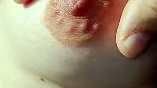 Amateur woman goes braless, nipples visible.